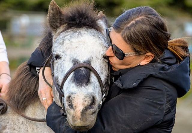 gina with a lesson horse